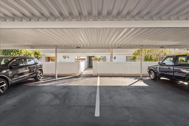 view of vehicle parking with a carport