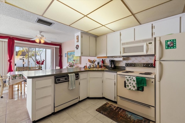 kitchen featuring white cabinetry, light tile patterned floors, ceiling fan, kitchen peninsula, and white appliances