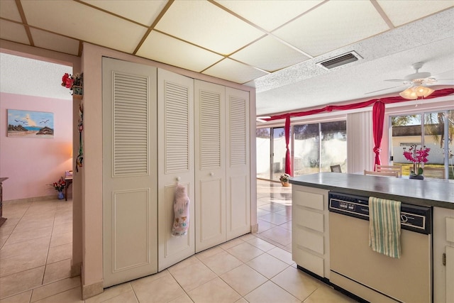 kitchen with dishwasher, light tile patterned flooring, and ceiling fan