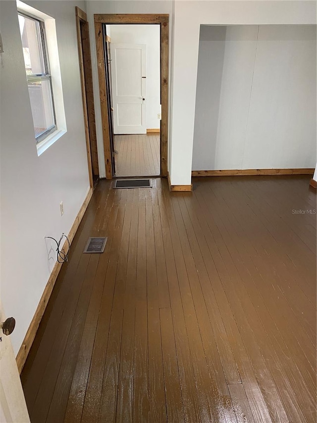 spare room with hardwood / wood-style flooring