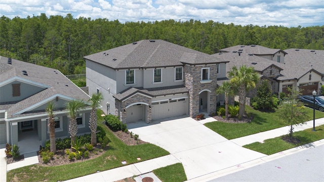 view of front of house with a front lawn and a garage