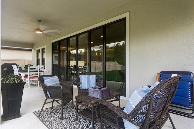 view of patio featuring ceiling fan