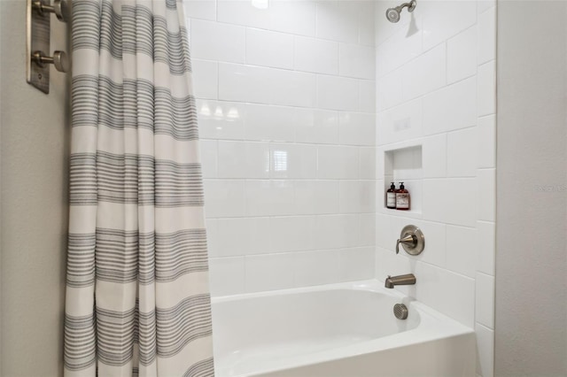 bathroom featuring shower / bath combo with shower curtain