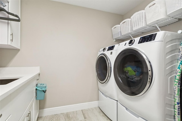 laundry area with washing machine and dryer