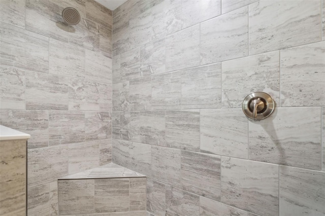 bathroom with a tile shower