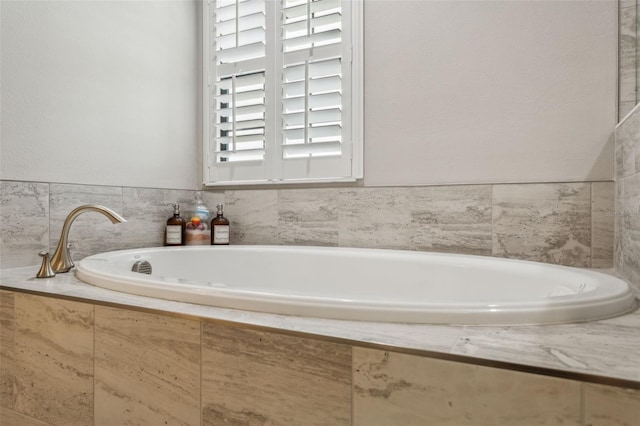 bathroom with tiled bath