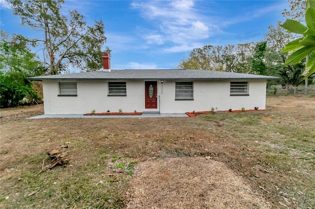 ranch-style home featuring a front yard