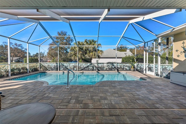 view of pool featuring a patio and glass enclosure