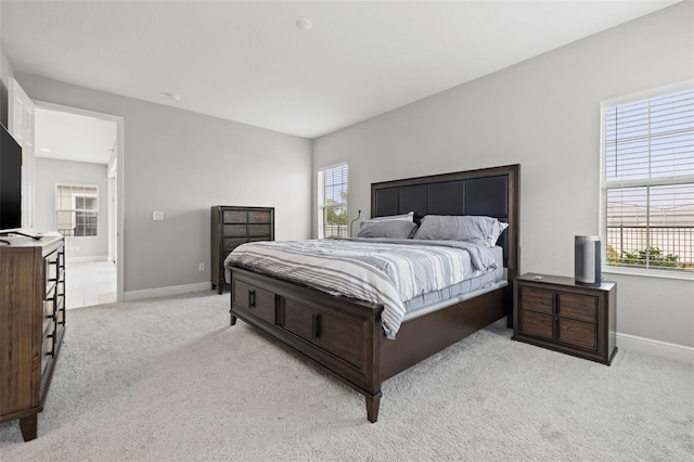 bedroom with light carpet