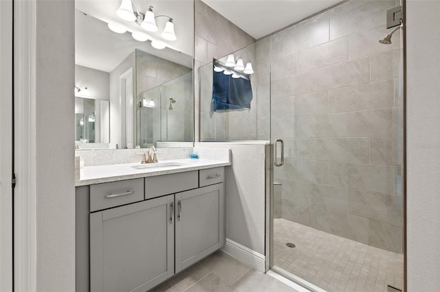 bathroom featuring vanity, tile patterned floors, and an enclosed shower