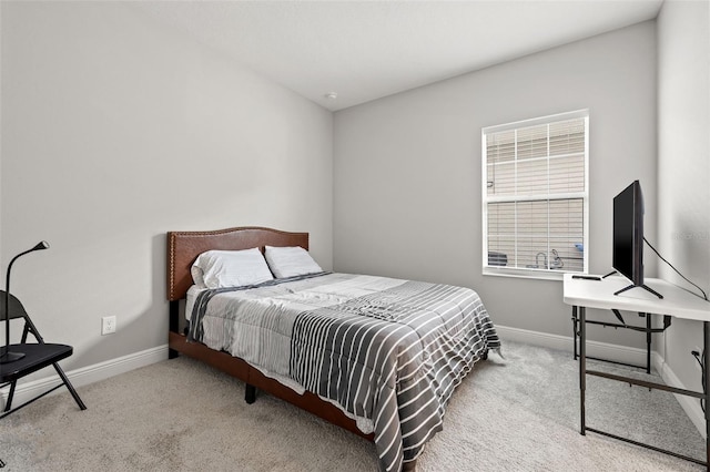 bedroom featuring light colored carpet