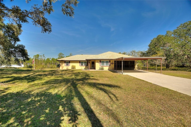 ranch-style house featuring a carport and a front yard