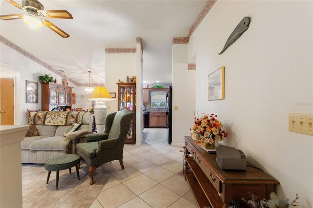 living room featuring light tile patterned flooring and ceiling fan