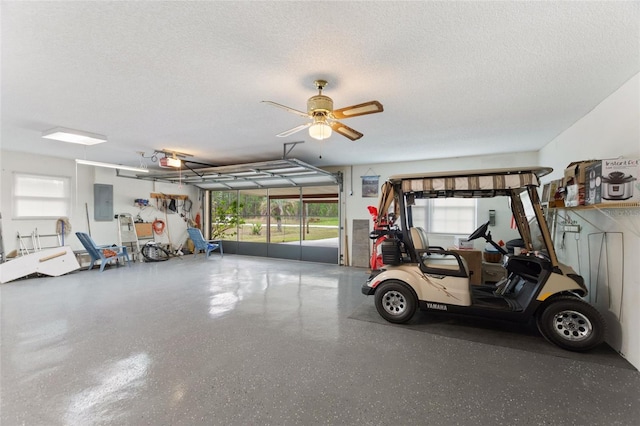 garage with a garage door opener and electric panel