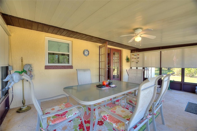 sunroom / solarium with wooden ceiling and ceiling fan