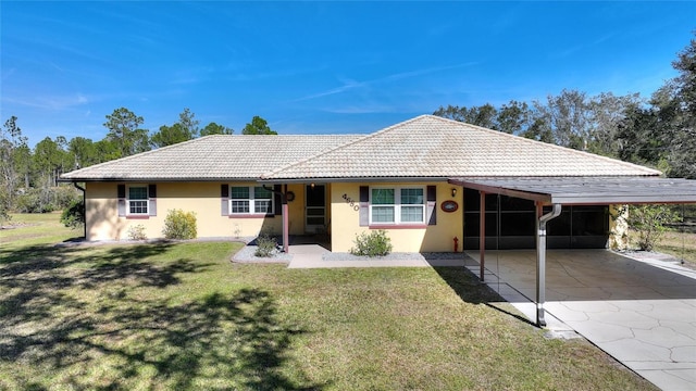 single story home featuring a carport and a front yard