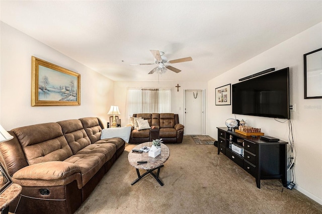 carpeted living room with ceiling fan