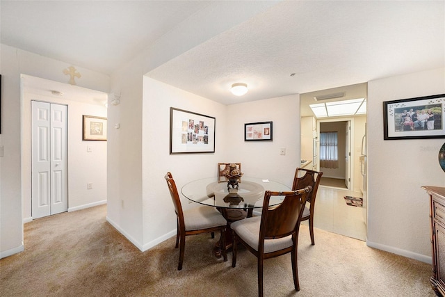 view of carpeted dining area