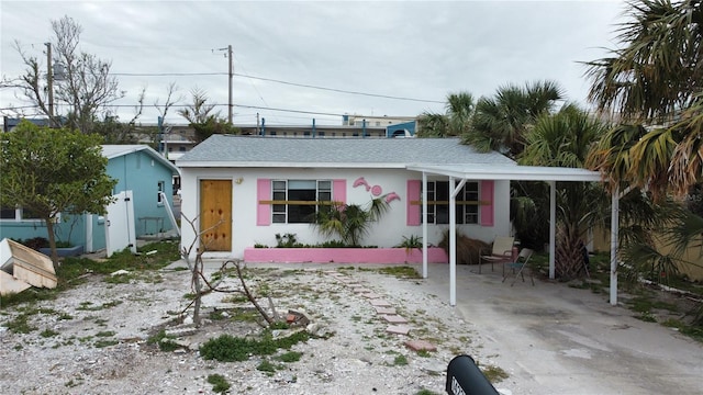 view of front of house with a carport