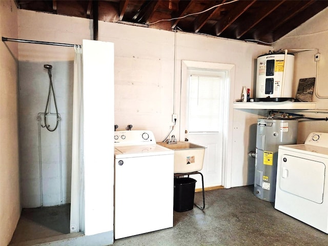 clothes washing area featuring sink, washer / dryer, and electric water heater