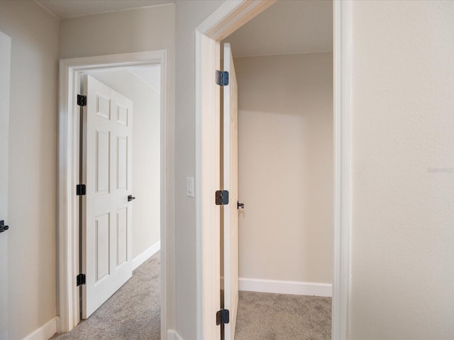 hallway with light carpet