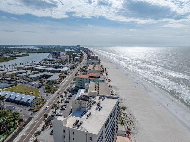 bird's eye view with a beach view and a water view