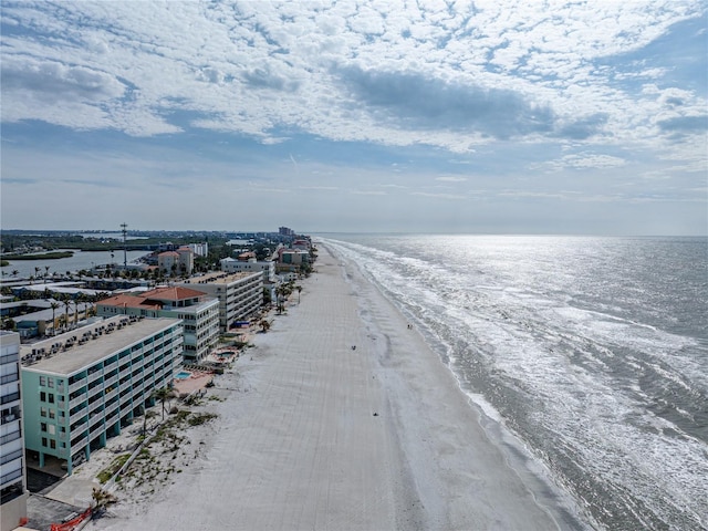 aerial view featuring a water view and a view of the beach