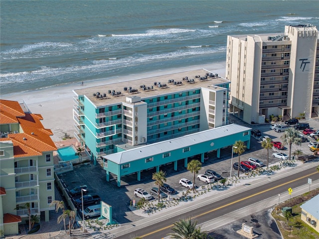 bird's eye view with a water view and a view of the beach