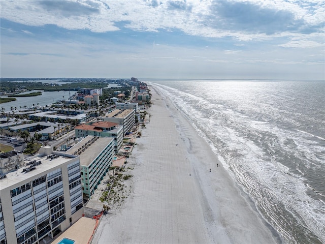 bird's eye view featuring a water view and a view of the beach