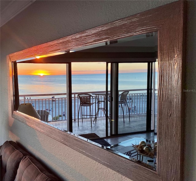 balcony at dusk with a water view