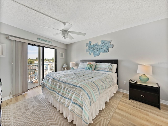 bedroom featuring ceiling fan, access to exterior, a textured ceiling, and light wood-type flooring