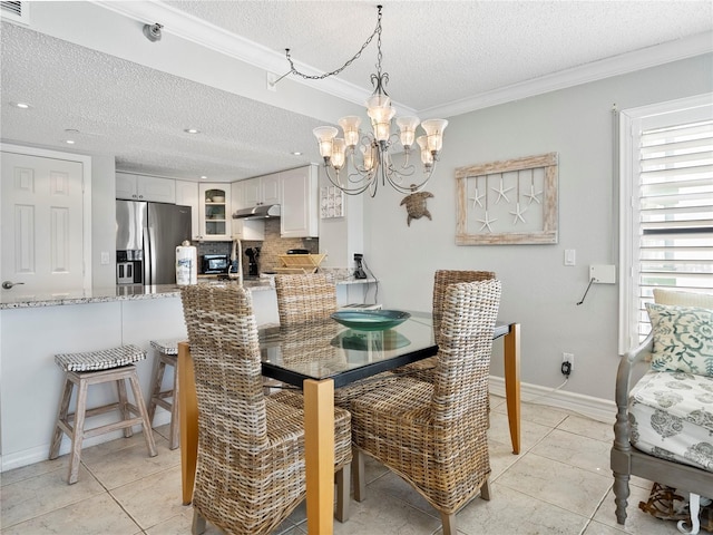 dining space with crown molding, a textured ceiling, light tile patterned floors, and a notable chandelier