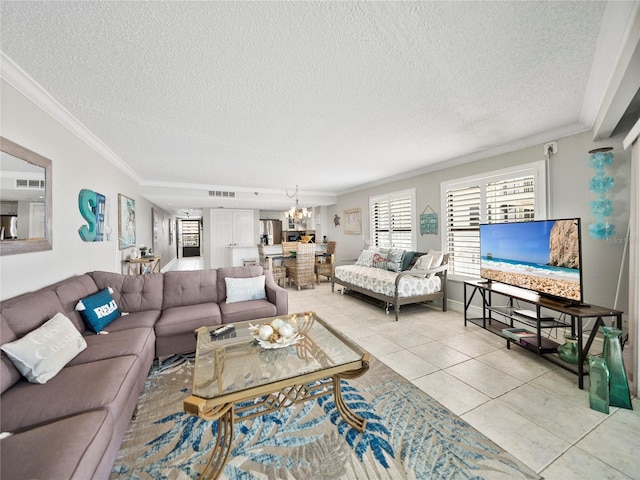 living room featuring ornamental molding, an inviting chandelier, light tile patterned floors, and a textured ceiling