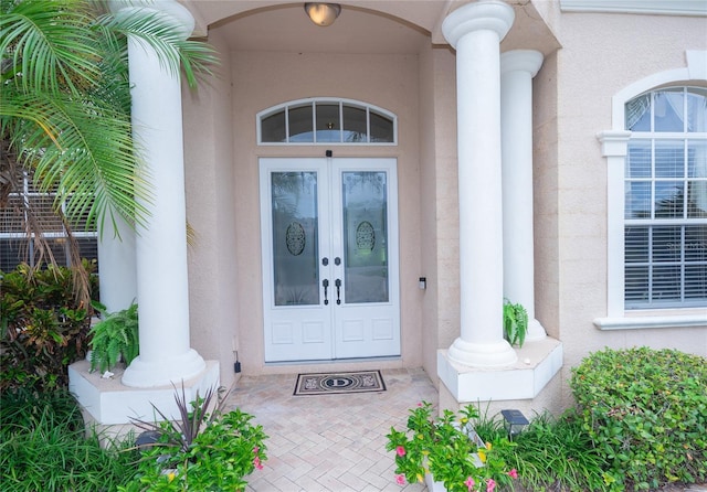 property entrance featuring french doors