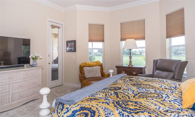 carpeted bedroom featuring crown molding