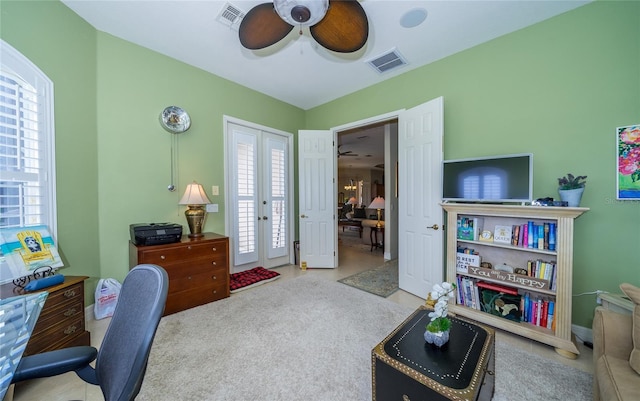 office area with light carpet, ceiling fan, and french doors