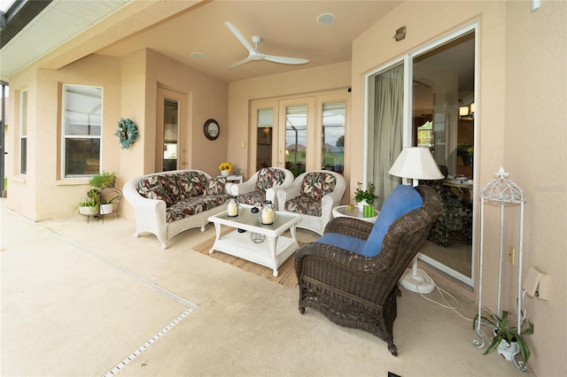 view of patio with ceiling fan and an outdoor living space