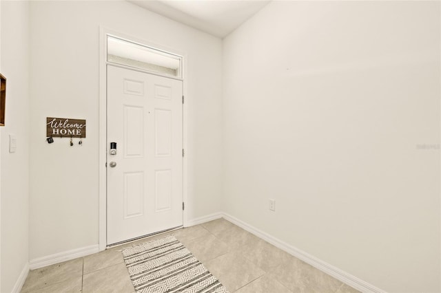 entrance foyer featuring light tile patterned floors