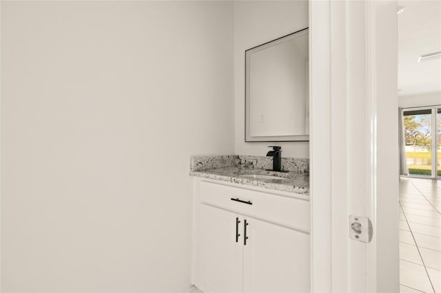 bathroom with vanity and tile patterned flooring