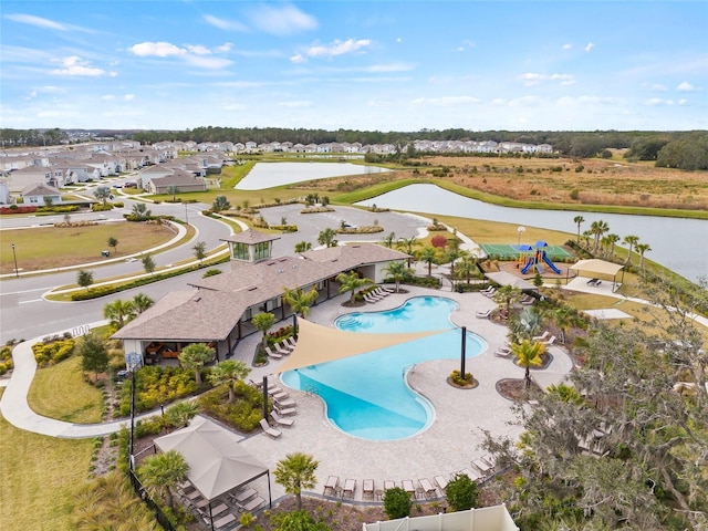 birds eye view of property with a water view