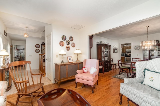 7312 7th Ave NW, Bradenton, FL 34209 - living room with a chandelier and light wood-style floors