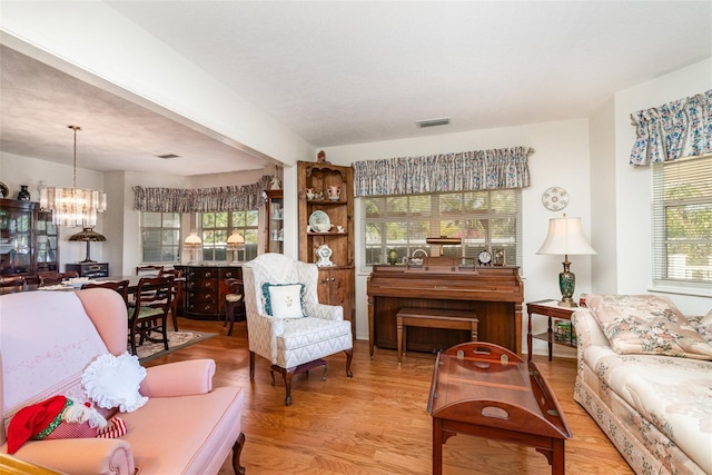 7312 7th Ave NW, Bradenton, FL 34209 - living area with a chandelier and wood finished floors