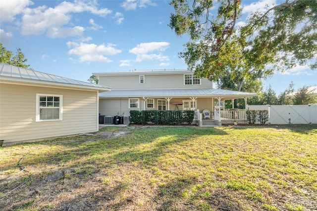 7312 7th Ave NW, Bradenton, FL 34209 - rear view of property featuring a porch, metal roof, cooling unit, a gate, and a standing seam roof
