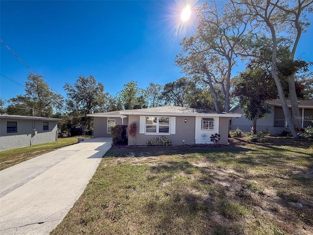 ranch-style house with a front yard