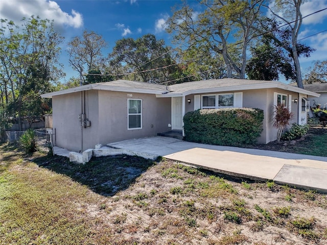 single story home featuring a patio area