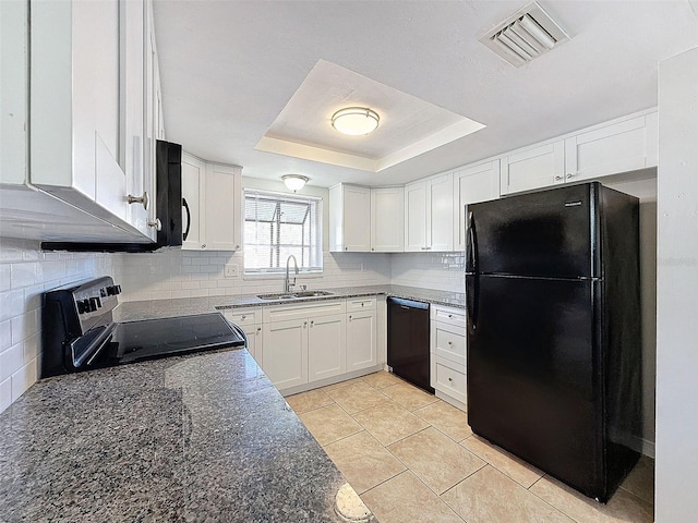 kitchen with black appliances, white cabinetry, sink, a raised ceiling, and light tile patterned floors