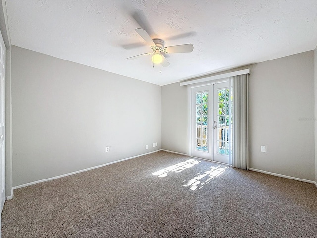 unfurnished room with ceiling fan, a textured ceiling, french doors, and carpet flooring