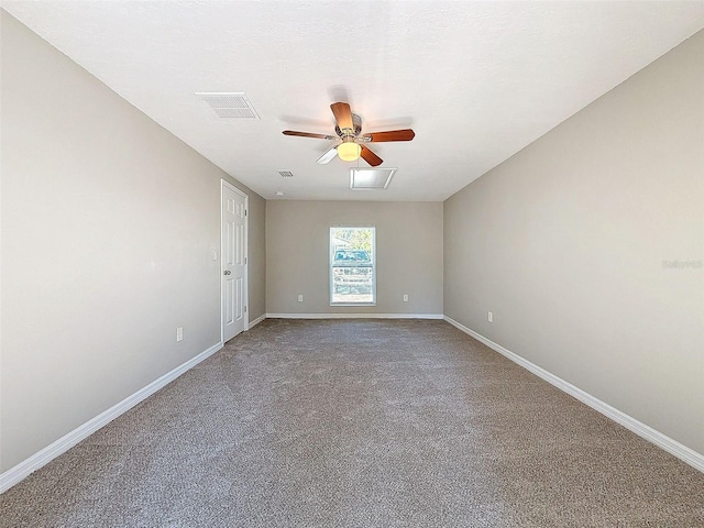 unfurnished room featuring ceiling fan and carpet flooring