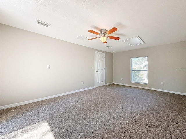 empty room with ceiling fan and carpet floors