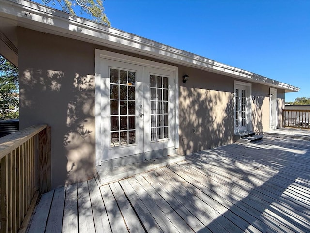 wooden terrace featuring french doors